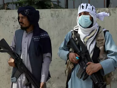 taliban people with guns