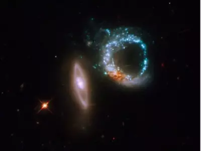 Hubble Image Shows Two Interacting Galaxies That Appear To Form The Number '10'