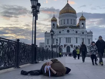 Russian Artist Lies Facedown With Hands Tied To Protest Grotesque Bucha Massacre