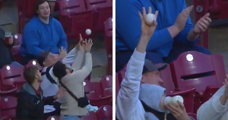 Watch fan catch foul ball while holding baby at Padres-Reds game