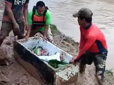 phillippines 11 year old boy survives landslide by sitting in a fridge for 20 hours 
