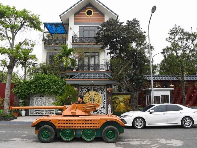 vietnam man converts minibus into wooden tank for son