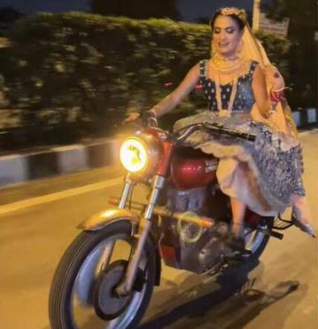 Bride rides a royal enfield bullet