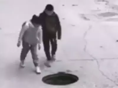 Children Cover Open Manhole On The Road 