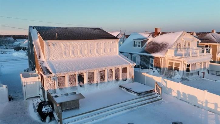 Drone footage showed houses in Brant Rock covered in iced sea spray. 