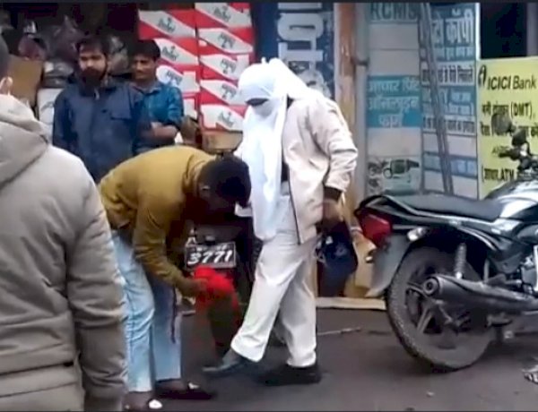 MP Cop forces passrby to clean her trousers slaps him