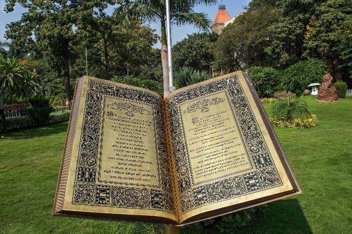 The constitution was adopted by the Indian Constituent Assembly on November 26, 1949, and came into effect 1 year later, on January 26, 1950, with a democratic government system. Indian Constitution book