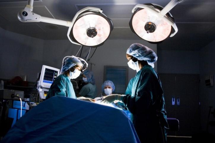 doctors performing surgery