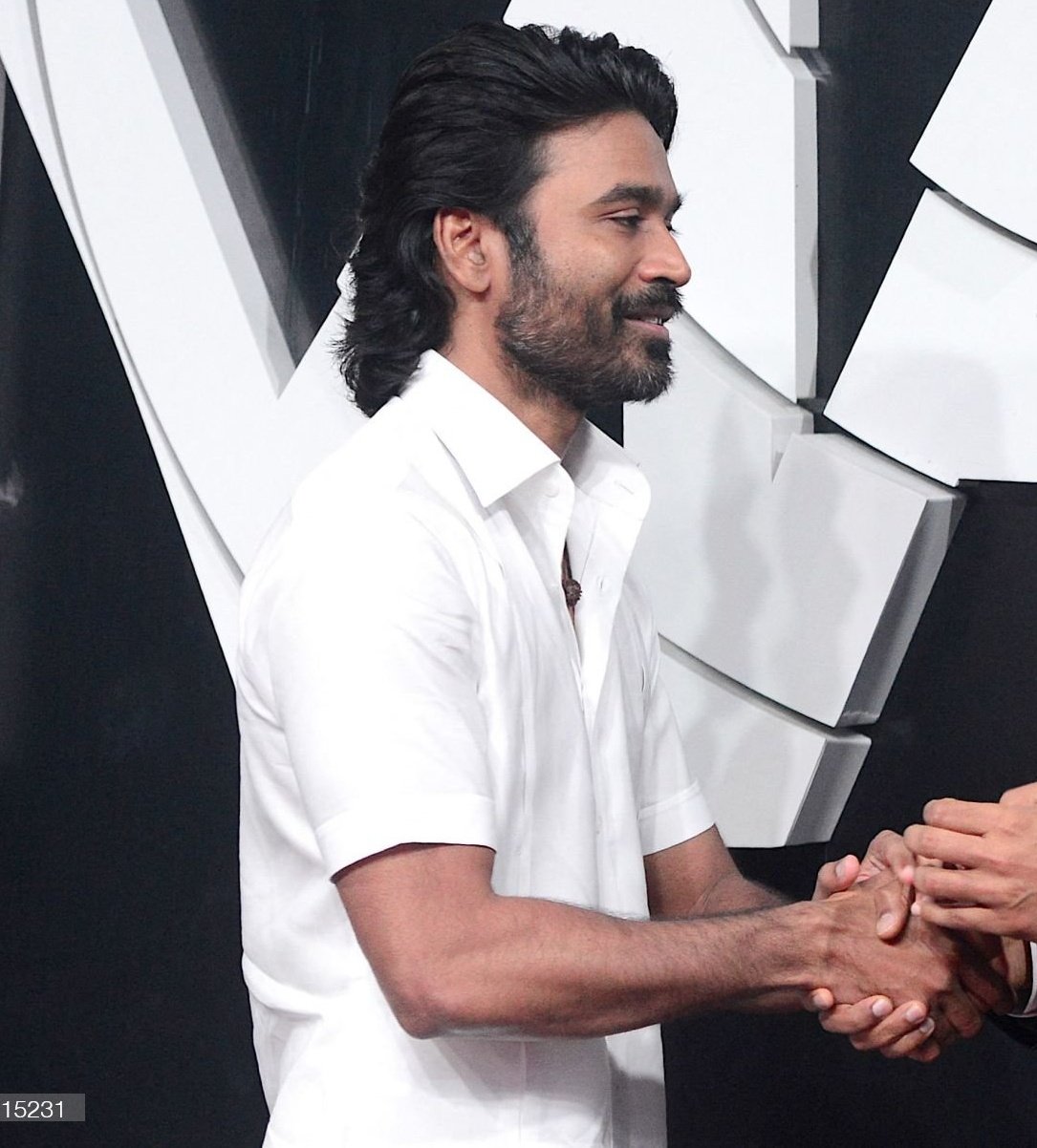 Dhanush Wears Veshti For 'The Gray Man' Mumbai Premiere, Poses