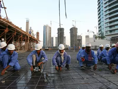 indian migrant worker working in a site in dubai