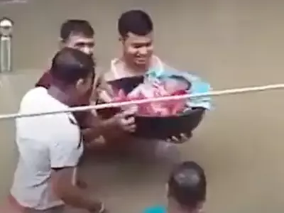 Assam Father Carries New Born