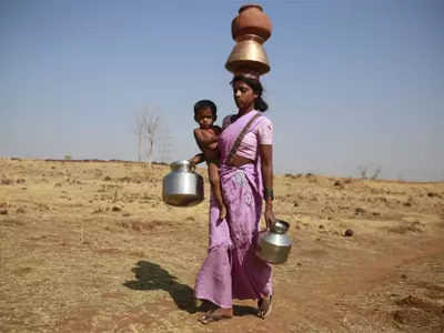 In Parched Maharashtra Villages, Locals Walk For Kilometers To Enter Deep Wells To Get A Pot Of Water