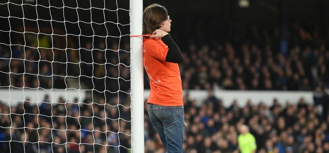 protester-forces-delay-in-english-top-flight-game-after-tying-himself