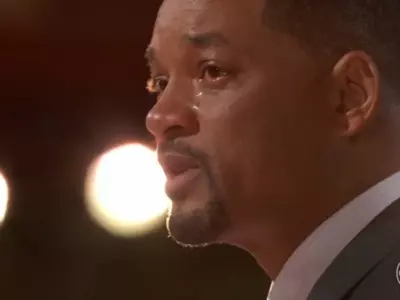 Will Smith tears up as he apologises for punching Chris Rock.