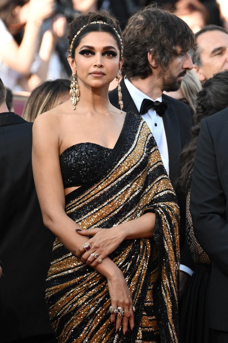 Sabyasachi Outfit: Deepika Padukone shows off Indian heritage in Sabyasachi  outfit, stuns in green-gold for Cannes jury photocall - The Economic Times