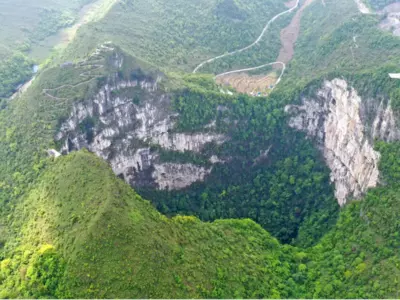 Ancient Forest Found At The Bottom Of A Giant 'Heavenly Pit' Sinkhole In China