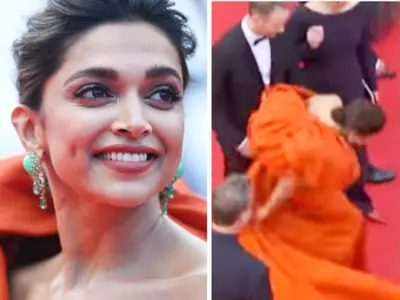 Deepika Padukone struggles to walk in her elaborate orange gown at Cannes red carpet event on Tuesday and the viral video has fans in splits. Some are even embarrassed. 