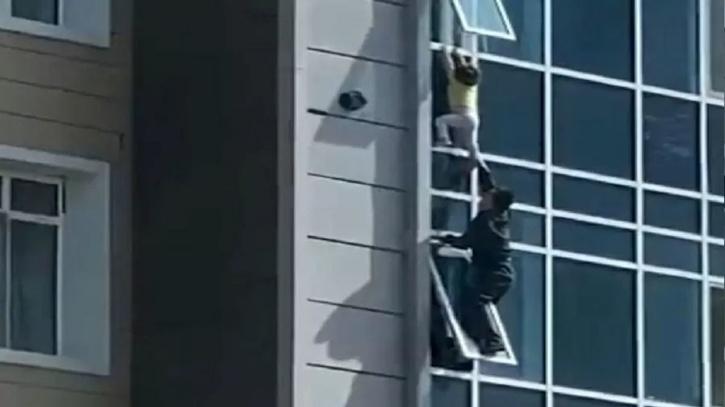 Kazakhstan Man Saves Child Hanging From Eighth Floor Window