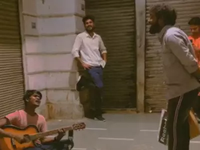 Man joins street musician