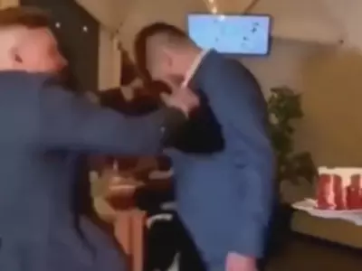 groom punches drunk man