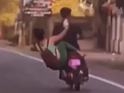 Girl Falls From Scooty