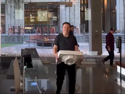 Elon musk carries a sink