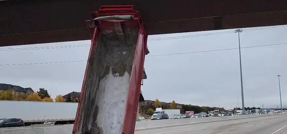 Canada Driver Gets Truck Stuck Vertically Under Overpass