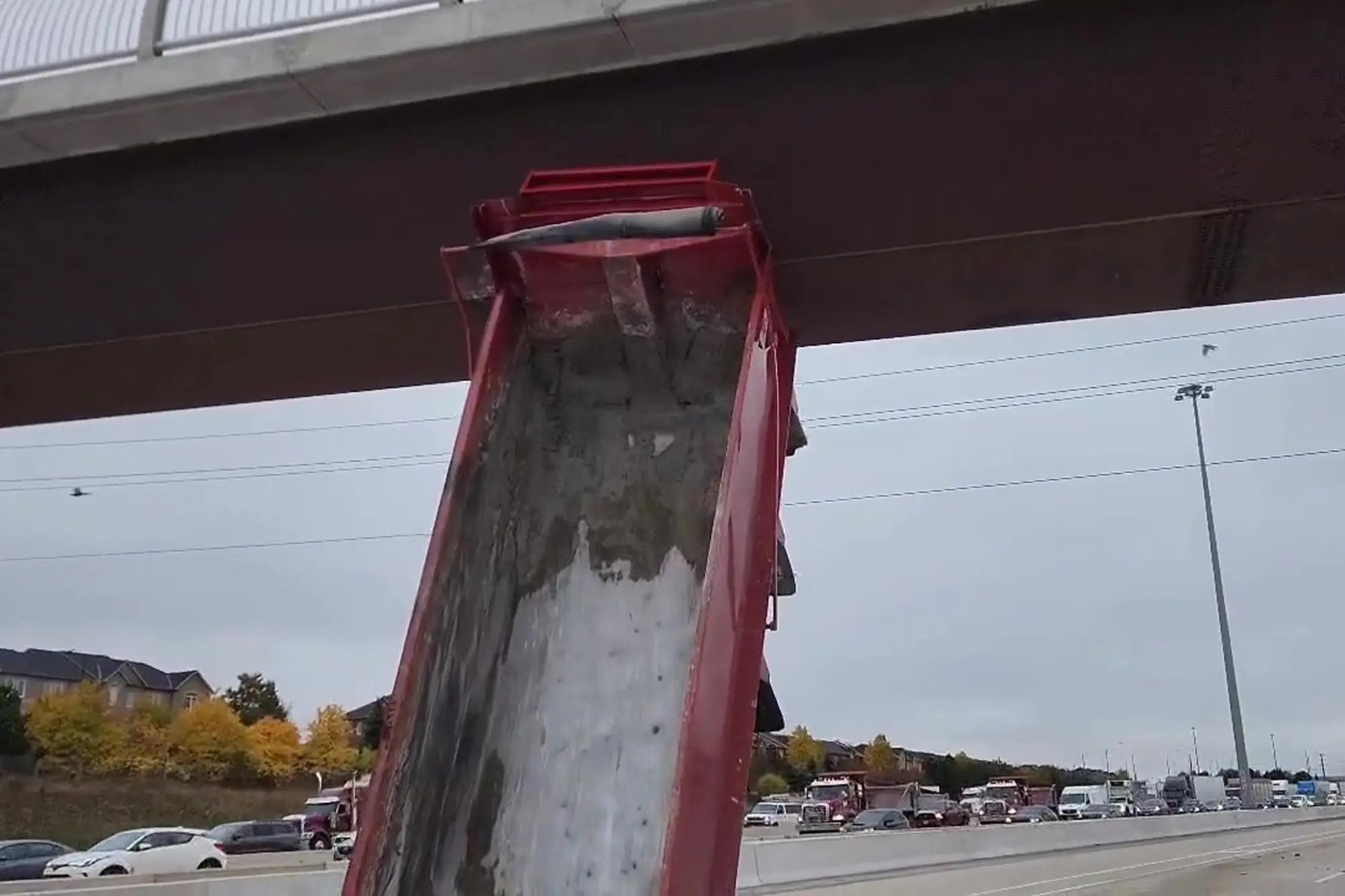 Canada: Driver Gets Truck Stuck Vertically Under Overpass