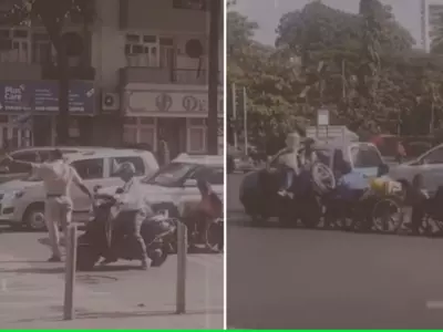 Mumbai traffic cop helps specially abled men