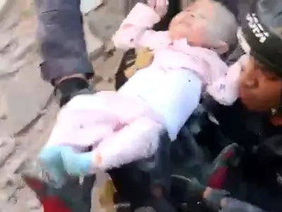 Baby pulled out of rubble alive