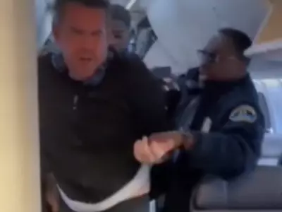 US First Class Passenger Dragged Off A Flight For Drink Request