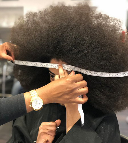 Aevin Dugas' biggest afro in the world sets another Guinness record