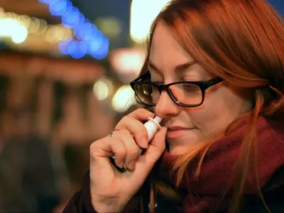 A women using Nasal spray