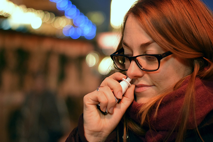 A women using Nasal spray