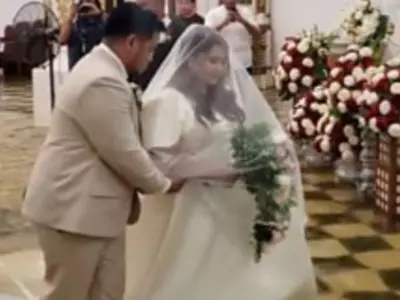 Bride Wades Through Flooded Church In The Philippines