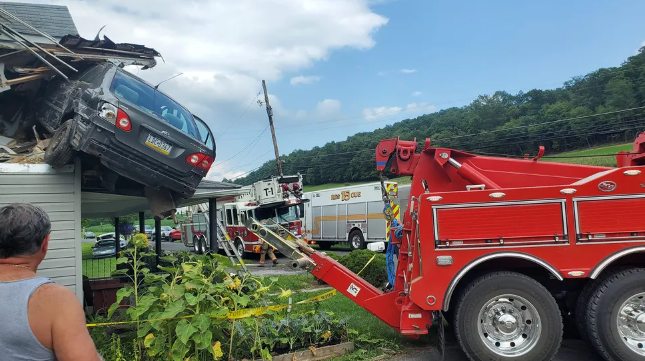 Several Photos Show That A Car Crashed Into A Second Floor Of A House In Pennsylvania, But No One Was Injured