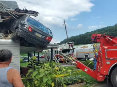 Several Photos Show That A Car Crashed Into A Second Floor Of A House In Pennsylvania, But No One Was Injured