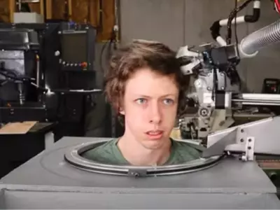 man builds a robot to cut his hair 