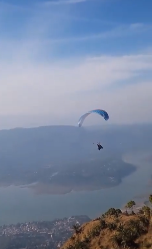 An electric scooter paraglider takes to the skies with a Punjabi Daredevil