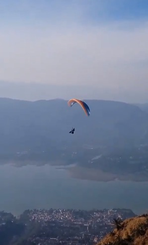 An electric scooter paraglider takes to the skies with a Punjabi Daredevil