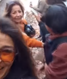 In front of a moving train, a woman almost loses her arm while taking a selfie