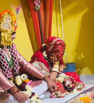 The video goes viral when the bride falls asleep during the wedding rituals, the groom reacts in a priceless way