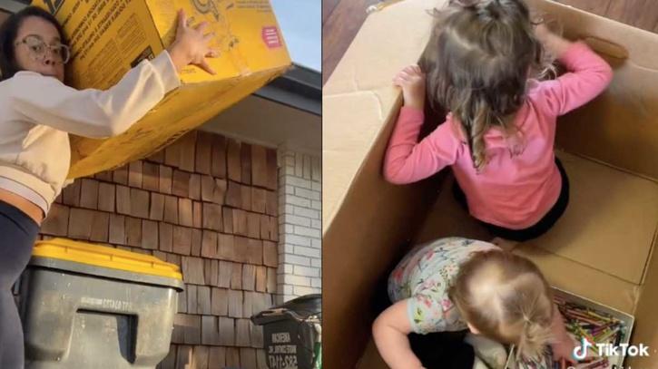 mother puts kids in cardboard box