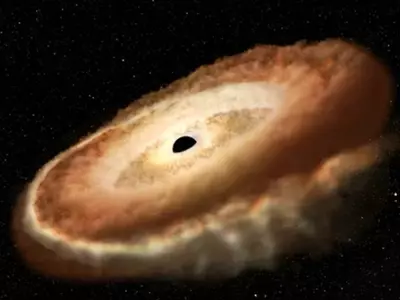 Hubble Spots Black Hole Twisting A Star Into A Doughnut As It’s Slowly Devoured