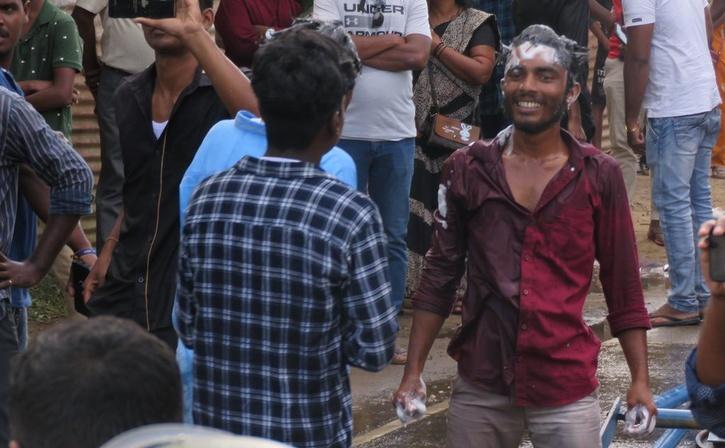 sri lanka police fire water cannon protestors Pull Out Shampoo to Wash Hair 