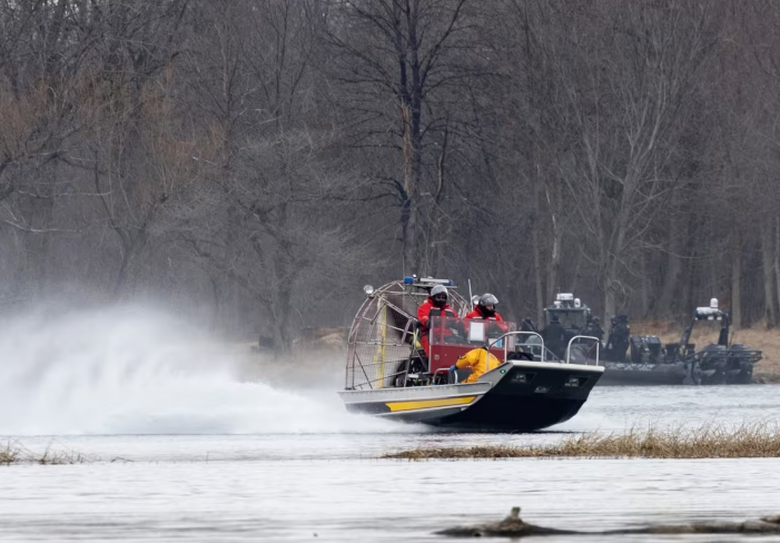 On March 31, 2023, crews search for bodies on the St. Lawrence River in Akwesasne following a tragic smuggling attempt that killed eight persons.