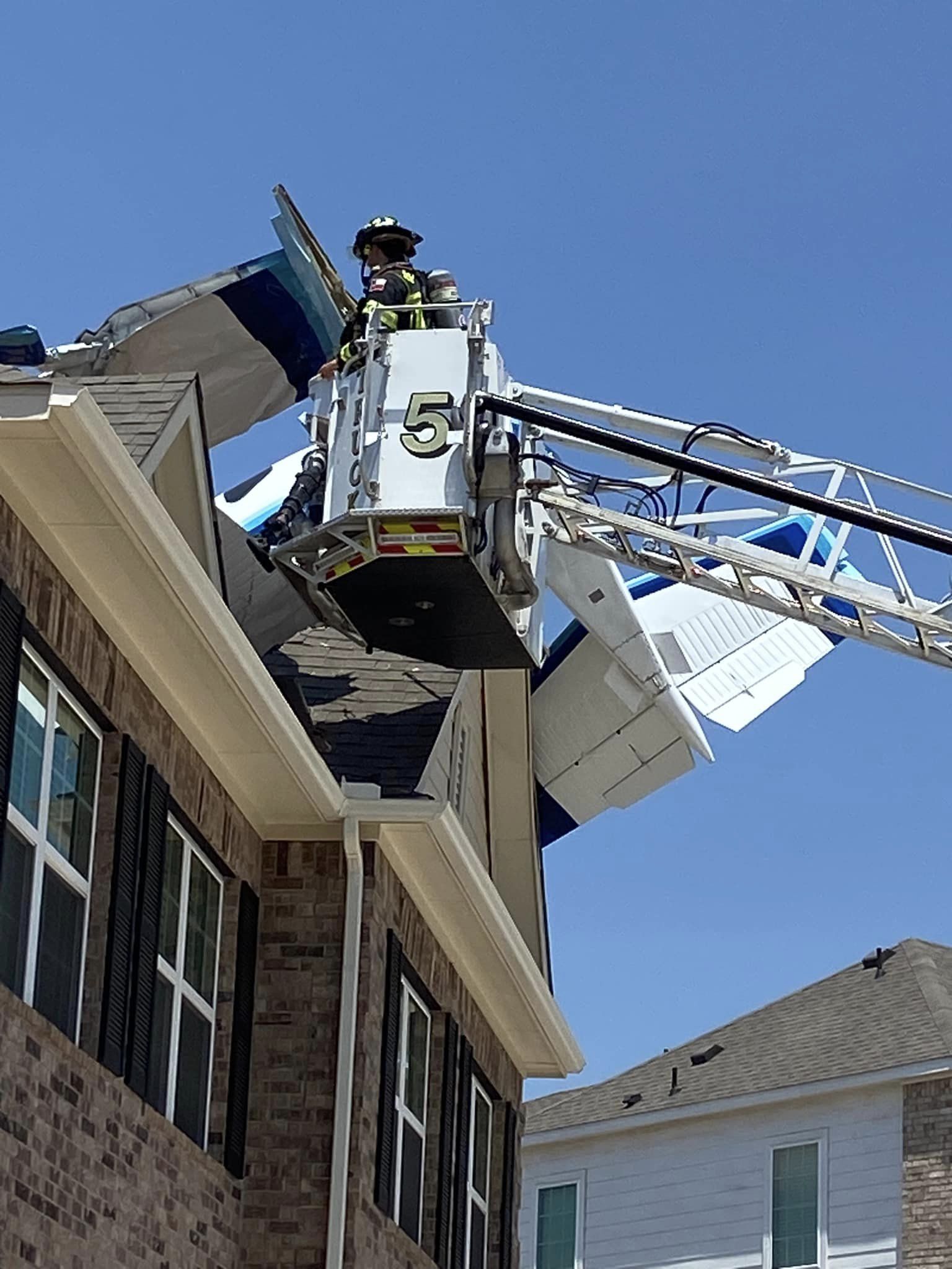 Plane crashes into the roof of a Georgetown duplex, injuring three
