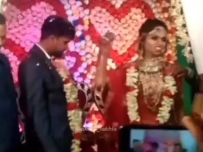 Groom's Reaction After Furious Bride Throws Sweets And Water Glass At Startled Guests Is Now A Viral Video