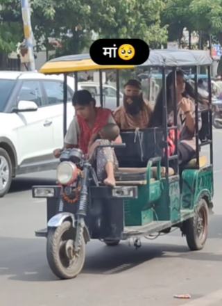 Woman Carries Child Drives E-Rickshaw