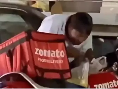 The Zomato Delivery Guy Is Spotted Eating Dal Chawal Out Of A Plastic Bag